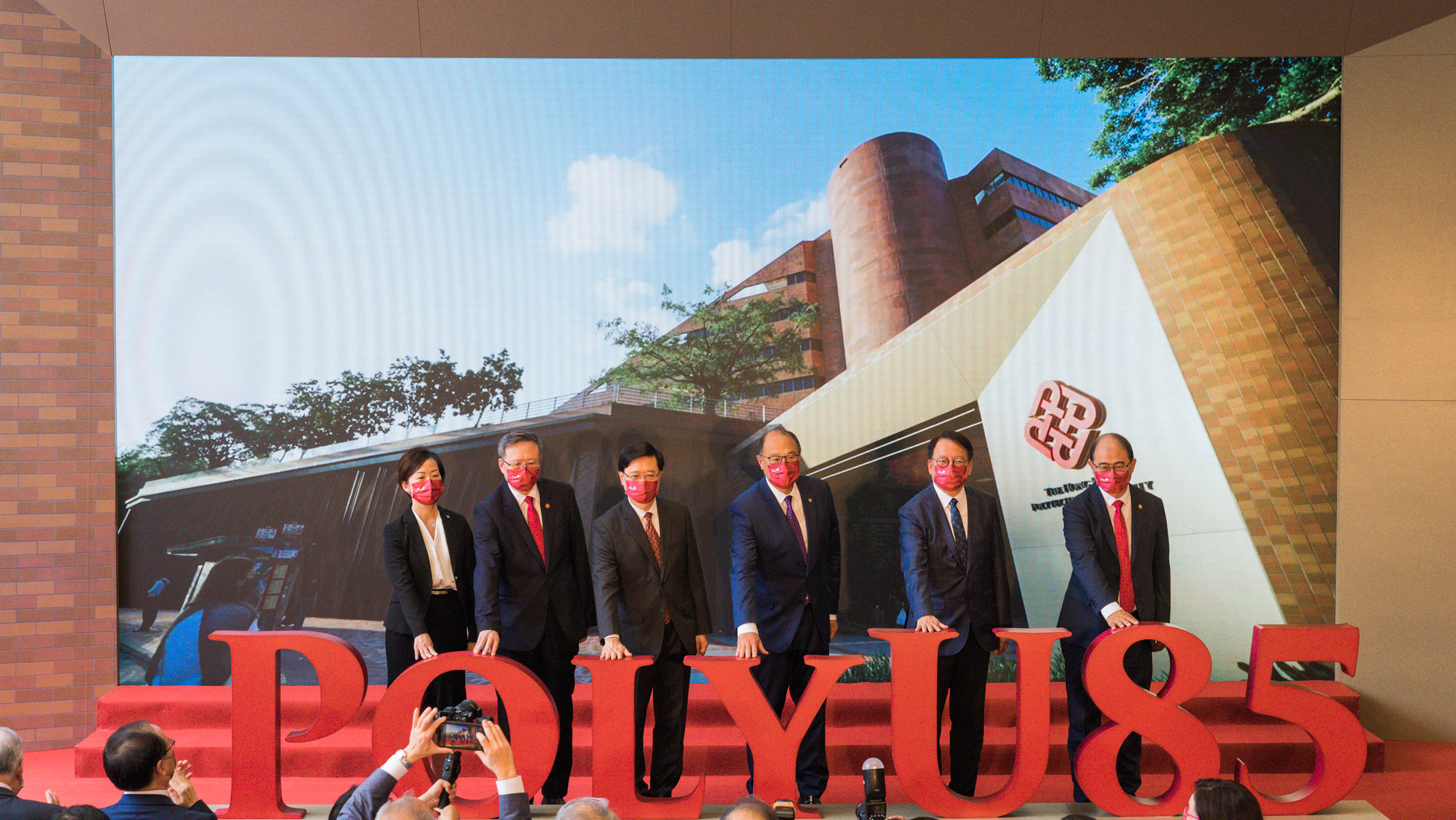 The Unveiling Ceremony was officiated by Guest-of-Honour Mr John K.C. Lee, Chief Executive of the HKSAR and Chancellor of PolyU (third from left); Mr Eric Chan, Chief Secretary for Administration of the HKSAR (second from right); Dr Lam Tai-fai, PolyU Council Chairman (third from right); Prof. Jin-Guang Teng, PolyU President (second from left); Prof. Wong Wing-tak, PolyU Deputy President and Provost (right); and Dr Miranda Lou, PolyU Executive Vice-President (left).