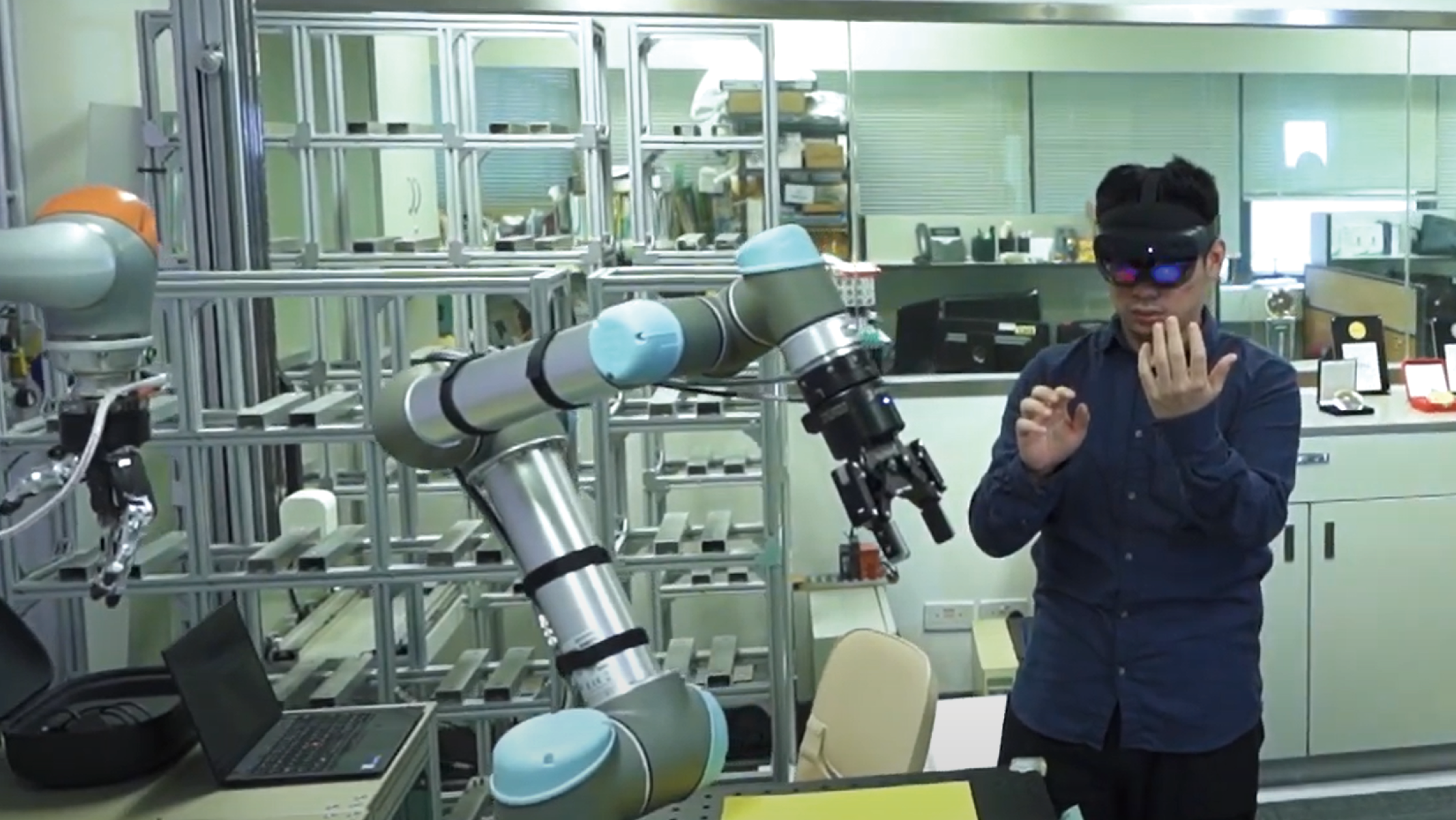 The project emulates the interaction between human operators and robots in an AR environment.