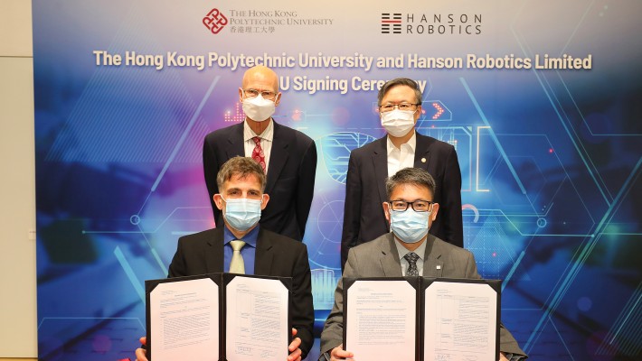 Prof. Christopher Chao, PolyU’s Vice President (Research and Innovation) (front row, right) and Dr David Hanson, CEO and Founder of Hanson Robotics (front row, left) signed the MoU to establish CHAiR. Witnessing the signing were Prof. Jin-Guang Teng, President of PolyU (back row, right) and Mr Doug Glen, Executive Director of Hanson Robotics (back row, left).