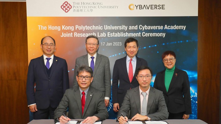 Prof. Jin-Guang Teng, President of PolyU (back row, second from left); Prof. Wing-tak Wong, Deputy President and Provost of PolyU (back row, first from left); Mr Johnny Mok SC, Co-founder of Cybaverse Academy (back row, second from right); and Dr Winnie Tang, Co-Founder of Cybaverse Academy (back row, first from right), witnessed the signing of the Memorandum of Establishment by Prof. Christopher Chao, Vice President (Research and Innovation) of PolyU (front row, left); and Mr Paul Li, Managing Director of Cybaverse Academy (front row, right).