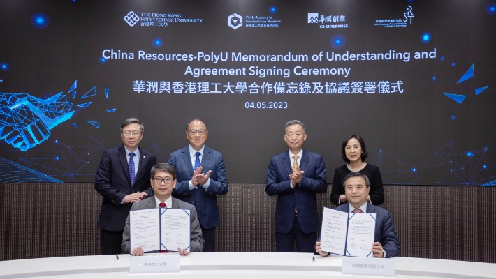 Witnessed by Mr Wang Xiangming, Chairman of China Resources Group (back row, second from right); Ms Wu Cheng, Deputy Director-General of the Department of Educational, Scientific and Technological Affairs of the Liaison Office of the Central People’s Government in the Hong Kong Special Administrative Region (back row, first from right); Dr Lam Tai-fai, Council Chairman of PolyU (back row, second from left); and Prof. Jin-Guang Teng, President of PolyU (back row, first from left), the MoU was signed by Mr Chen Ying, Assistant General Manager of China Resources Group, Chairman and CEO of China Resources Enterprise (front row, right), and Prof. Christopher Chao, Vice President (Research and Innovation) (front row, left) of PolyU.