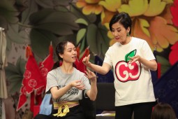 A student receiving guidance from Dr Liza Wang (right) on the art of Cantonese opera