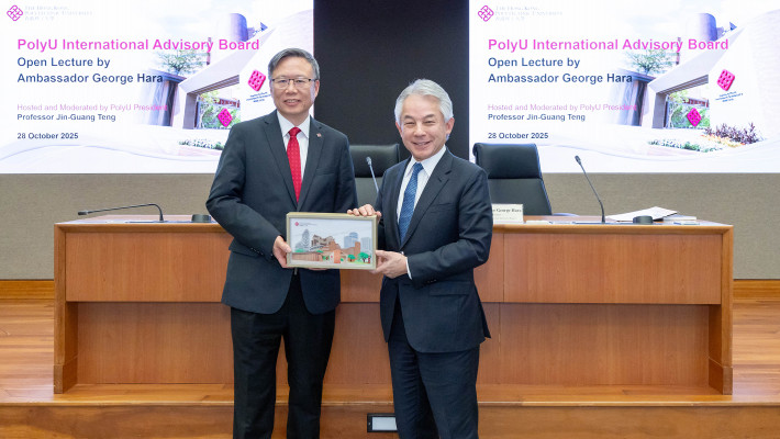 Prof. Jin-Guang Teng (left) welcomes Ambassador George Hara (right) to PolyU.
