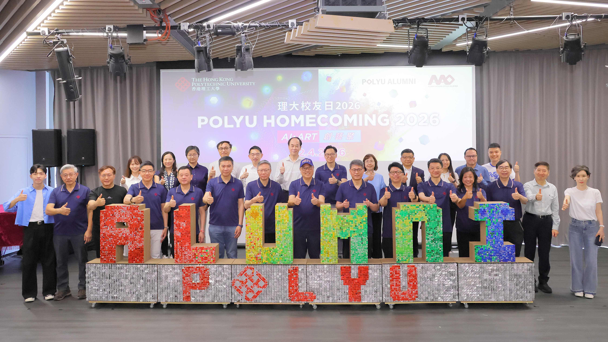 Dr Lam Tai-fai (centre, front row) and Prof. Teng (7th from left, front row) joined members of the PolyU leadership team and other faculty in kicking off the PolyU Homecoming 2026.