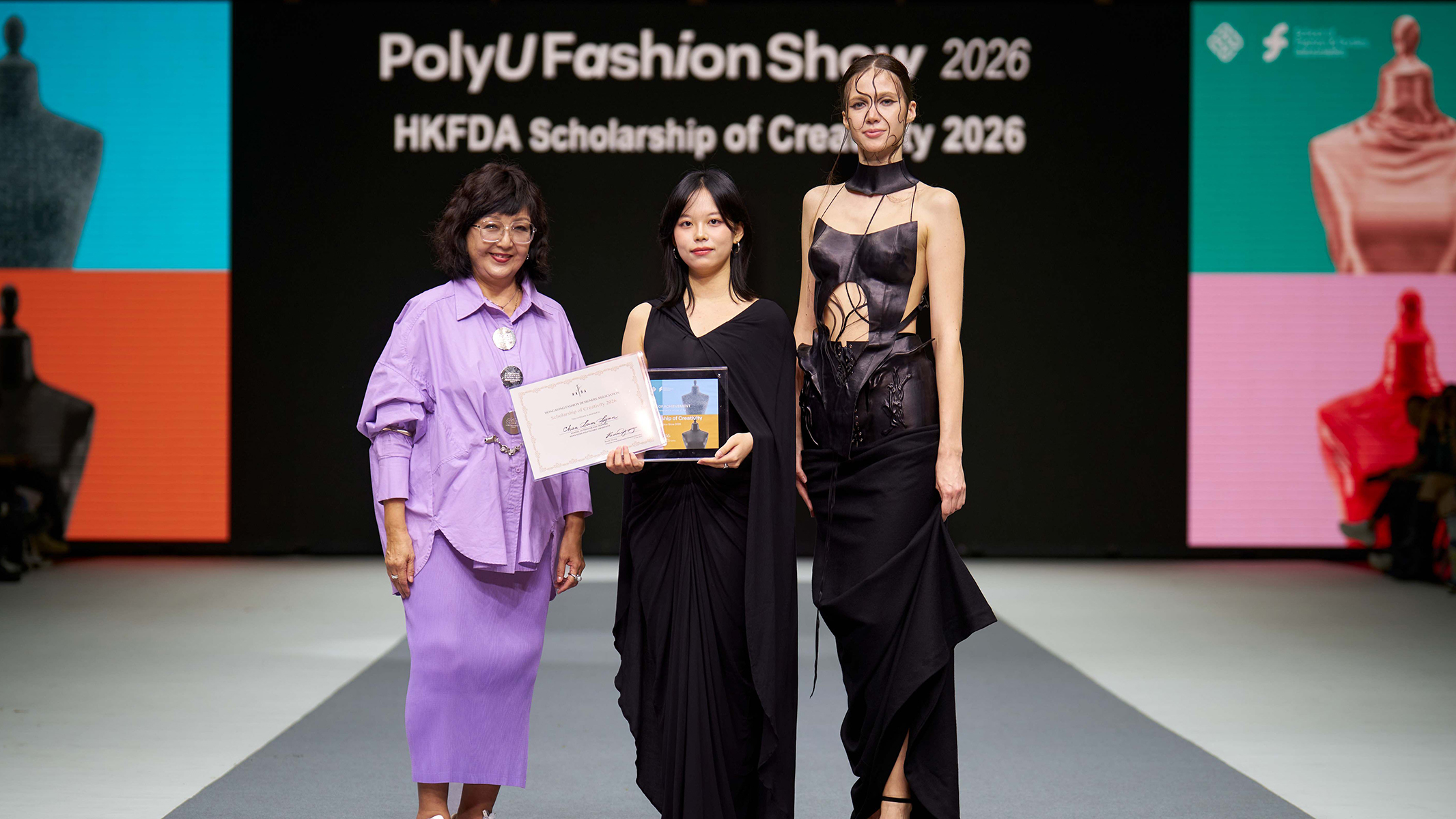 The HKFDA Scholarship of Creativity 2026 was won by Chan Lam, Lynn (centre) for the collection themed “The Boat With Severed Ropes”.