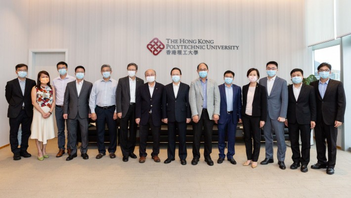 Prof Jin-Guang Teng, President of PolyU (sixth from left), Prof Wing-tak Wong, Deputy President and Provost (sixth from right), and Dr Miranda Lou, Executive Vice President (fourth from right), warmly welcome Dr Tieniu Tan, Deputy Director of the Liaison Office of the Central People’s Government in the Hong Kong SAR (seventh from right), and his delegation.