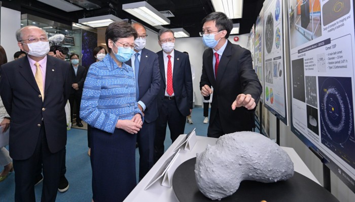 Professor Wu Bo (right), Associate Head of Department of Land Surveying and Geo-Informatics presented future research projects on space explorations to Mrs Lam