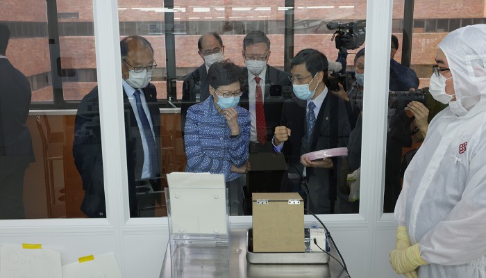 Professor Daniel Lau (second from right), Head of Department of Applied Physics, presented the University Research Facility in Materials Characterization and Device Fabrication to Mrs Lam