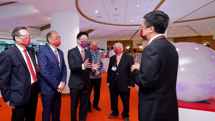 Prof. Wu Bo, Associate Head (Research) and Professor of the Department of Land Surveying and Geo-Informatics (1st right), and Prof. Yung Sir Sze-yuen Chung Professor in Precision Engineering, Chair Professor of Precision Engineering and Associate Head of Department of Industrial and Systems Engineering (2nd right), introduced their award-winning national space mission projects to Prof. Dong Sun, Secretary for Innovation, Technology and Industry (3rd left), escorted by Dr Lam Tai-fai, PolyU’s Council Chairman (2nd left) and Prof. Jin-Guang Teng, President of PolyU (1st left).