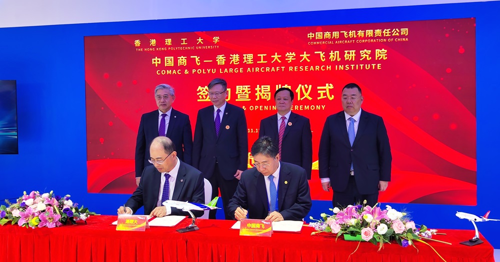 Witnessed by Prof. Jin-Guang TENG, President of PolyU (back, 2nd from left), Prof, H.C. MAN, Dean of the Faculty of Engineering of PolyU (back, 1st from left), Mr HE Dongfeng, Chairman of COMAC (back, 2nd from right) and Mr YUAN Guohua, Vice-Chairman of COMAC (back, 1st from right), the agreement was signed by Prof. Wing-tak WONG, Deputy President and Provost of PolyU (front, left) and Mr SHEN Bo, Vice President of COMAC (front, right).