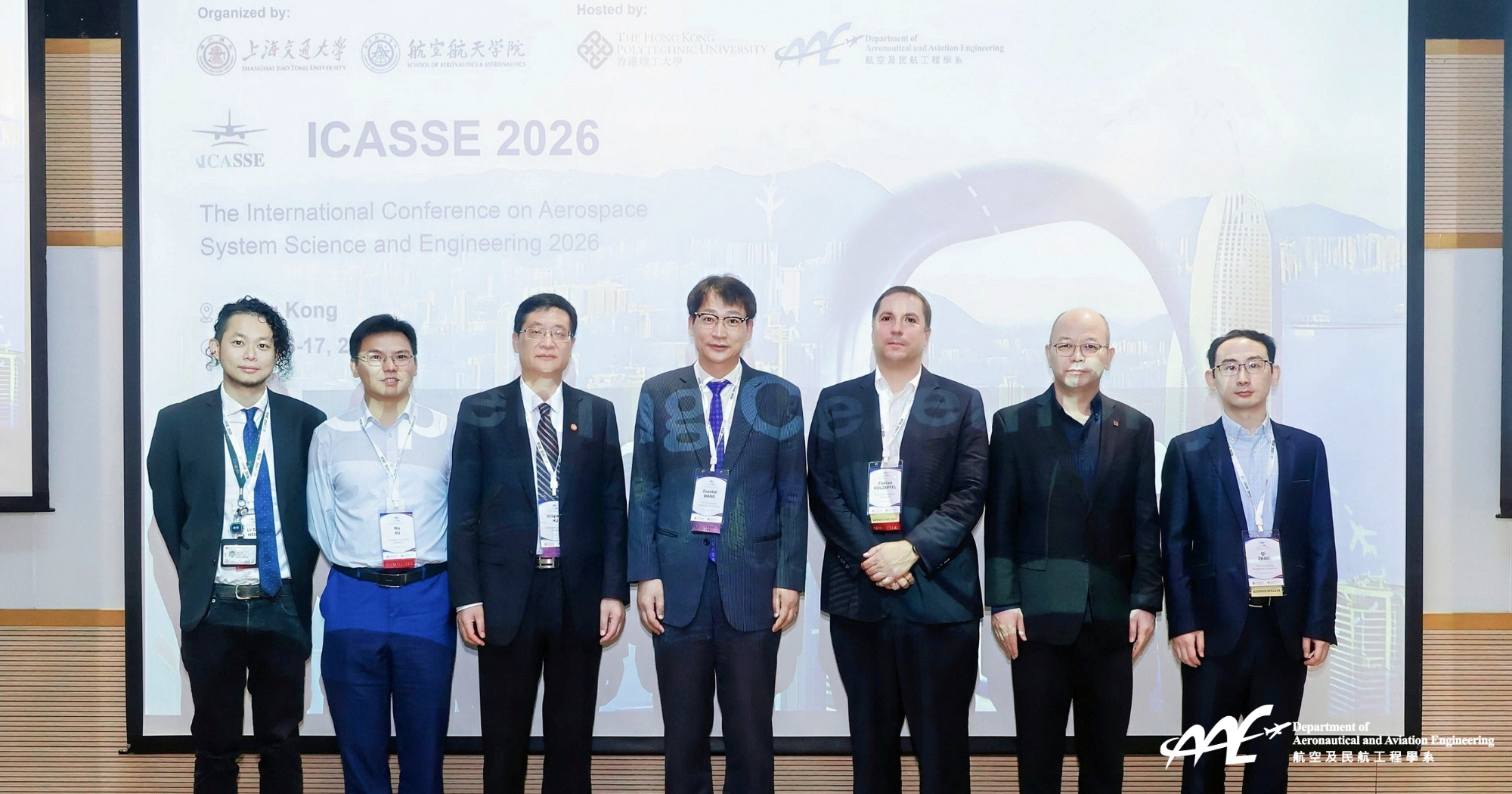 Group photo of the ICASSE 2026 General Chairs and distinguished guests: (From left to right) Prof. Li-Ta Hsu (Associate Professor, Limin Young Scholar in Aerospace Navigation at PolyU AAE); Prof. Wu Xu (Vice Dean of SJTU SAA); Prof. Shiqiang Hu (Secretary of the CPC Committee at SJTU SAA); Prof. Wang Zuankai (Associate Vice President (Research) at PolyU); Prof. Florian Holzapfel (Technical University of Munich); Prof. Hongyu Yu (Executive Director of the PolyU Aerospace Research Academy); and Prof. Qi Zhao (PolyU CEE).