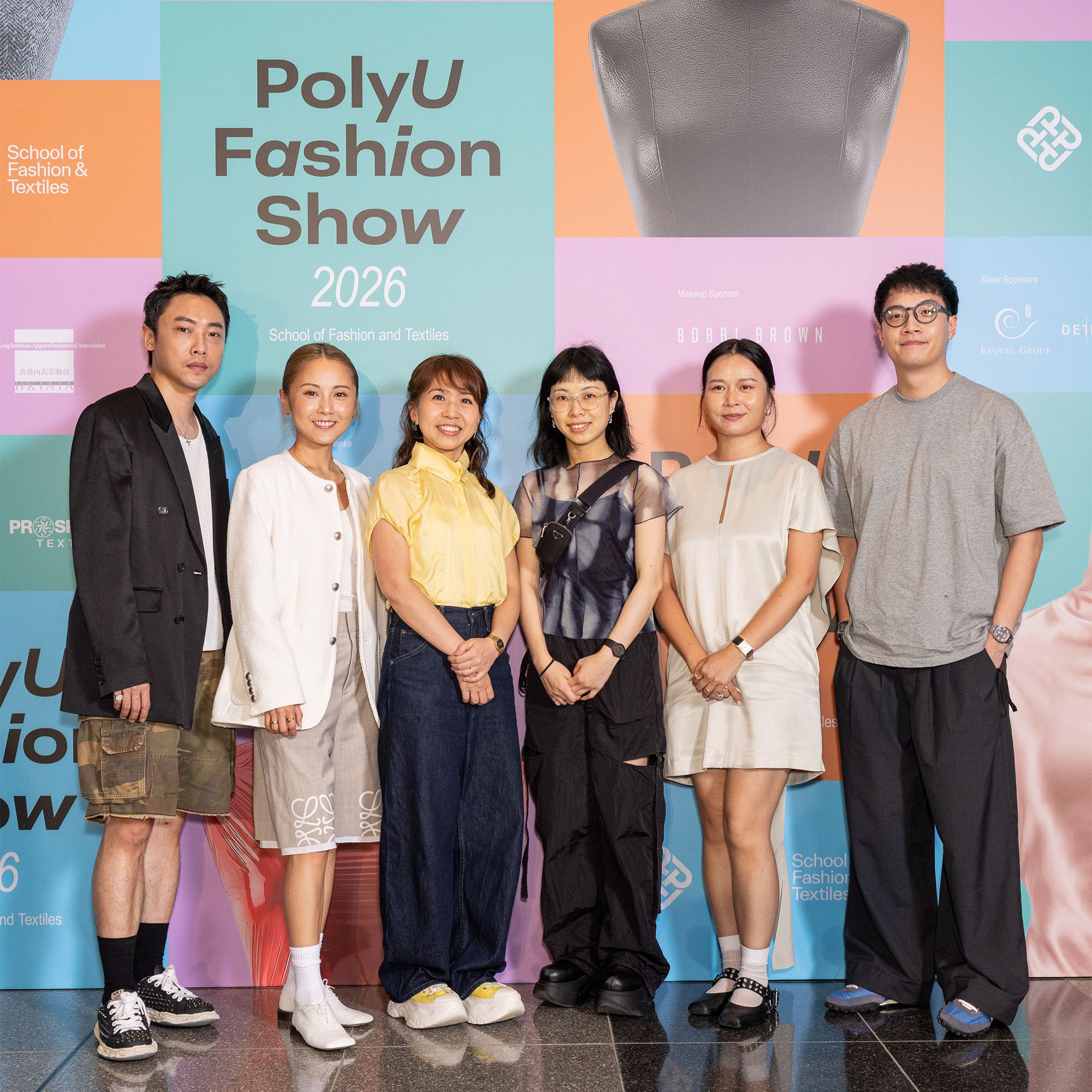 Dr Lo Kawai, Fashion Show Chairlady (third from right), expressed her heartfelt appreciation to the five distinguished alumni who served as judges for the Consinee Grand Award, including Ms Anne Chow (third from left) of Consinee Group Co. Limited; Ms Constance Lee (second from left), fashion stylist; Ms Florence Tsui (second from right) of ONS Clothing - New York; and renowned designers Mr Kit Wan (first from left) and Mr Wilson Yip (first from right).
