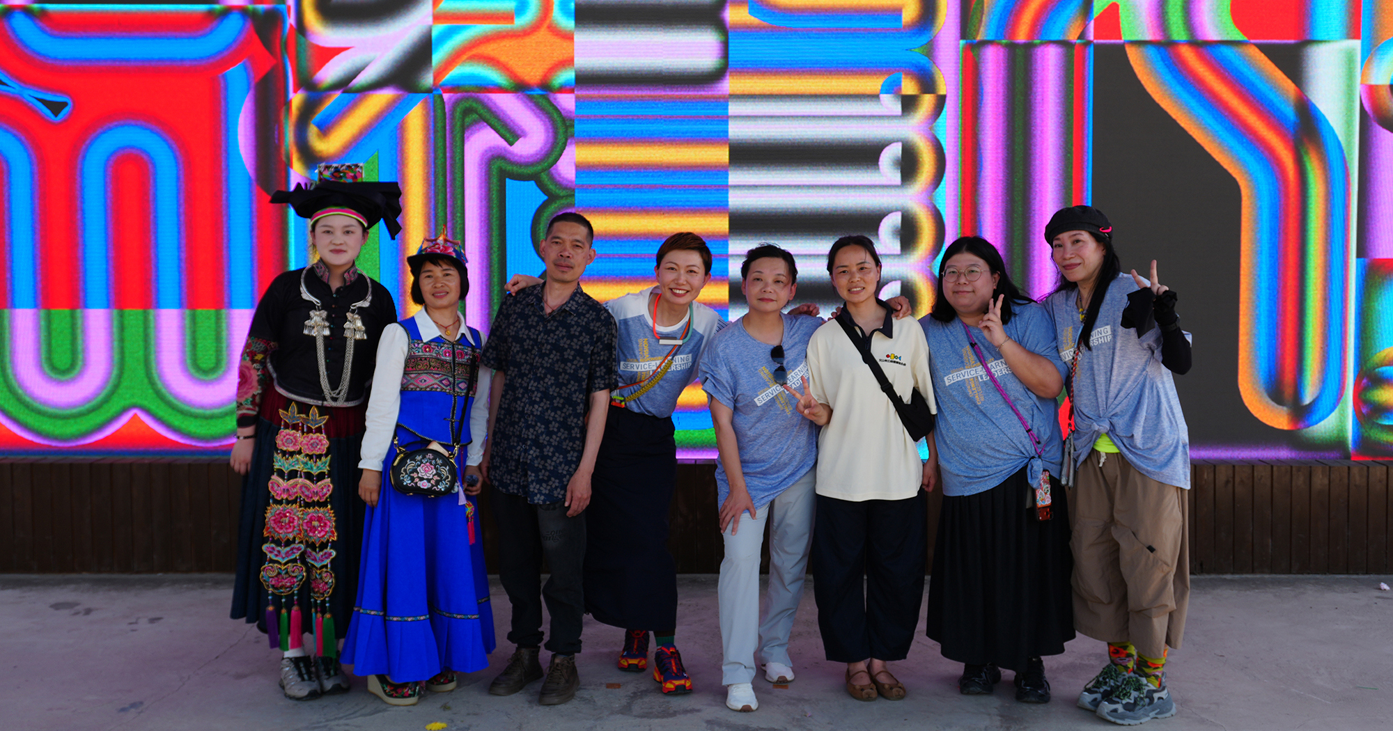 Prof. Jin Lam (4th from left) led 36 PolyU students to join forces with YNU students and local ethnic minority artisans of "Paohua Embroidery" in Yunnan to co-create a groundbreaking contemporary fashion collection.