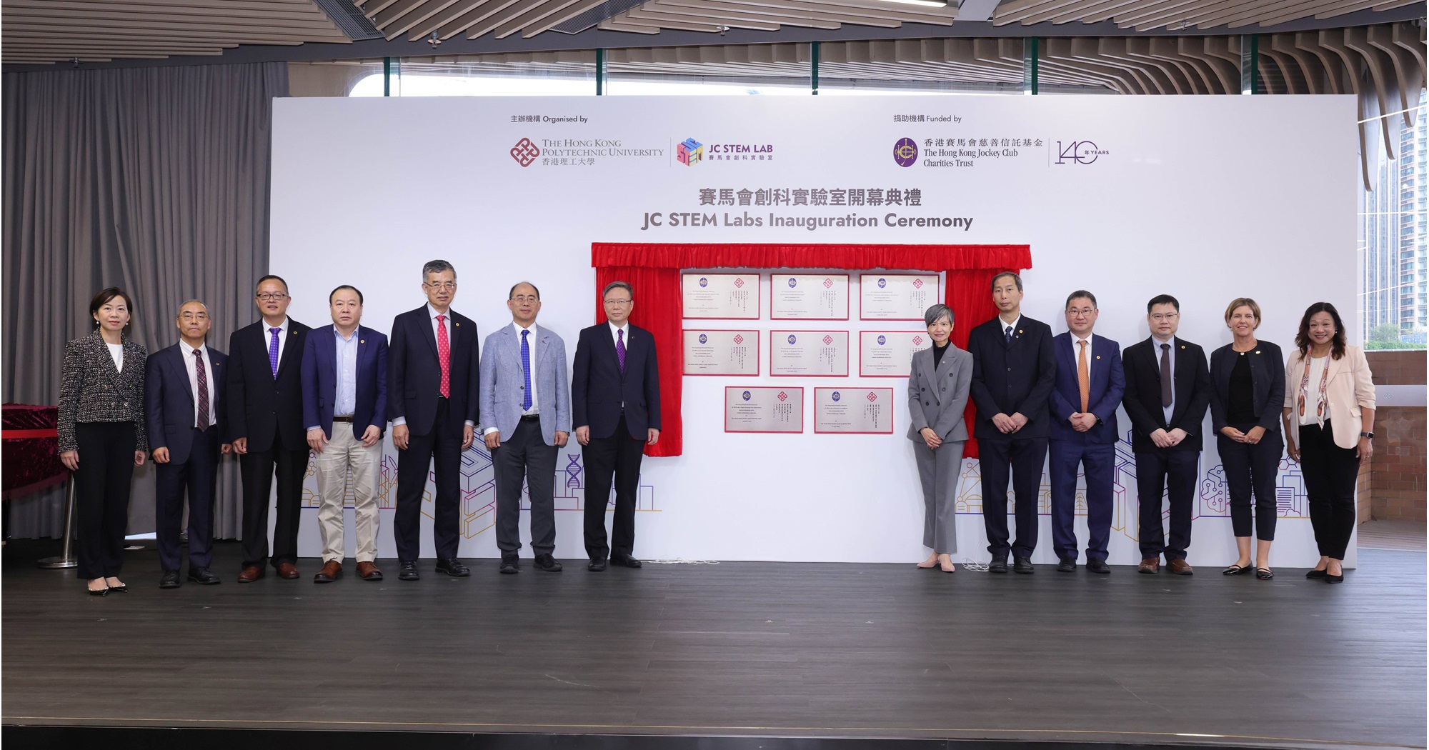 Prof. Jin-Guang Teng, PolyU President (7th from left); Prof. Wing-tak Wong, PolyU Deputy President and Provost (6th from left); and Ms Elsie Tsang, Executive Manager of Charities (Talent and Sector Development) of The Hong Kong Jockey Club (6th from right); Dr Miranda LOU, PolyU Executive Vice President (1st from left); and Dr Laura LO, PolyU Associate Vice President (Institutional Advancement (1st from right) congratulated the Directors on the inauguration of the eight JC STEM Labs.